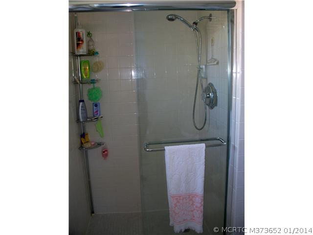 1919 Southwest Palm City Road, Unit 10J Stuart, FL 34994 - Photo 13 of 25 Master Bath/Spa. Walk-in shower with glass doors.