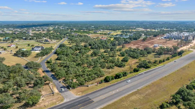 an aerial view of residential houses with city view
