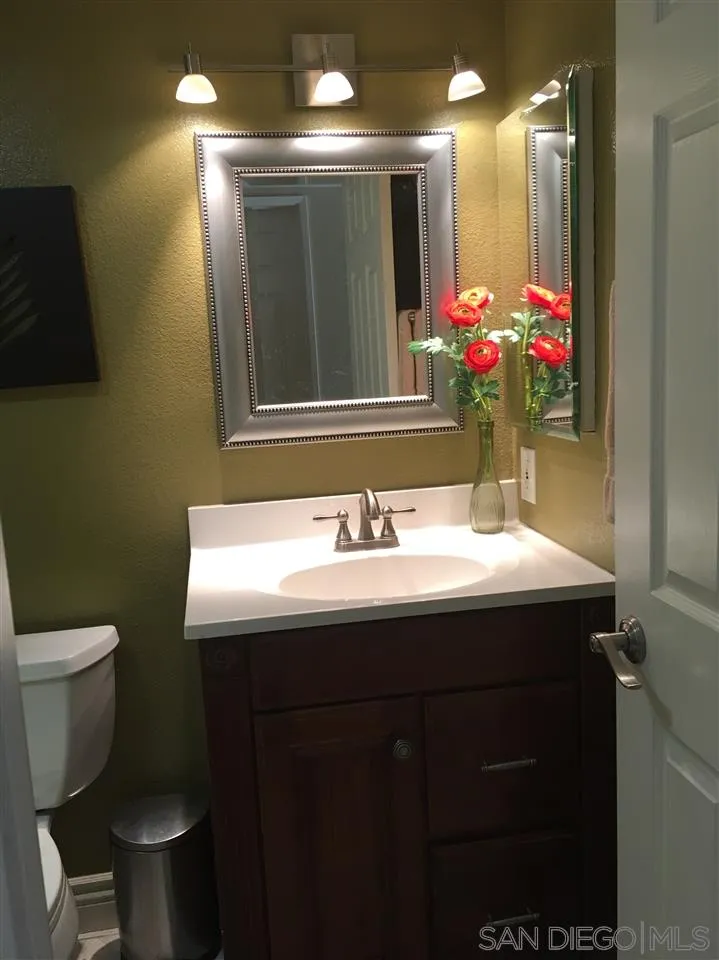 12701 Triumph Drive Poway, CA 92064 - Photo 11 of 21 a bathroom with a sink and a mirror