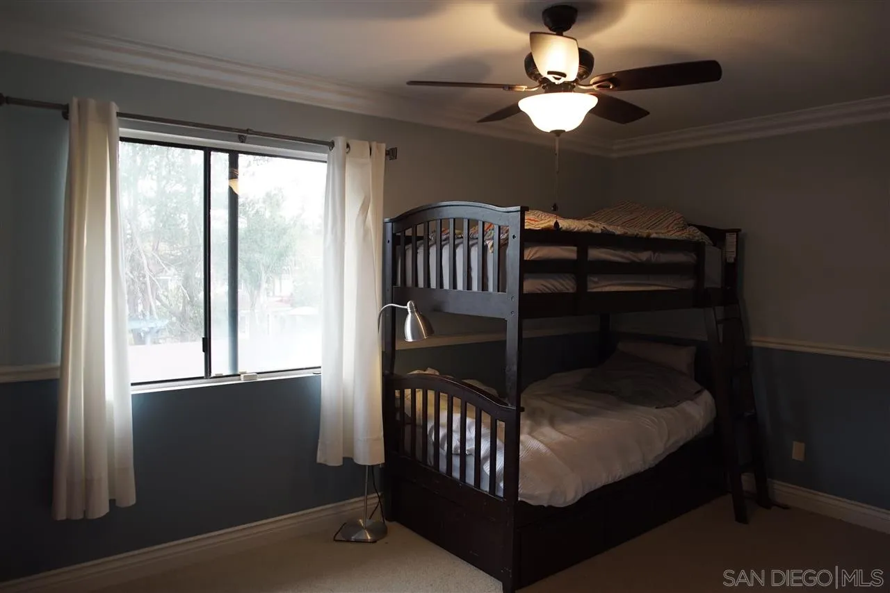 12701 Triumph Drive Poway, CA 92064 - Photo 16 of 21 a bedroom with bunk beds and a chandelier