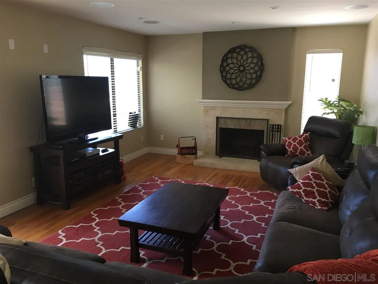 12701 Triumph Drive Poway, CA 92064 - Photo 17 of 21 a living room with furniture a rug and a flat screen tv