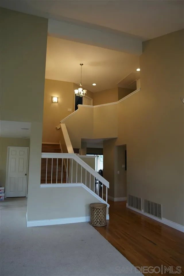 12701 Triumph Drive Poway, CA 92064 - Photo 4 of 21 a view of entryway and hall with wooden floor
