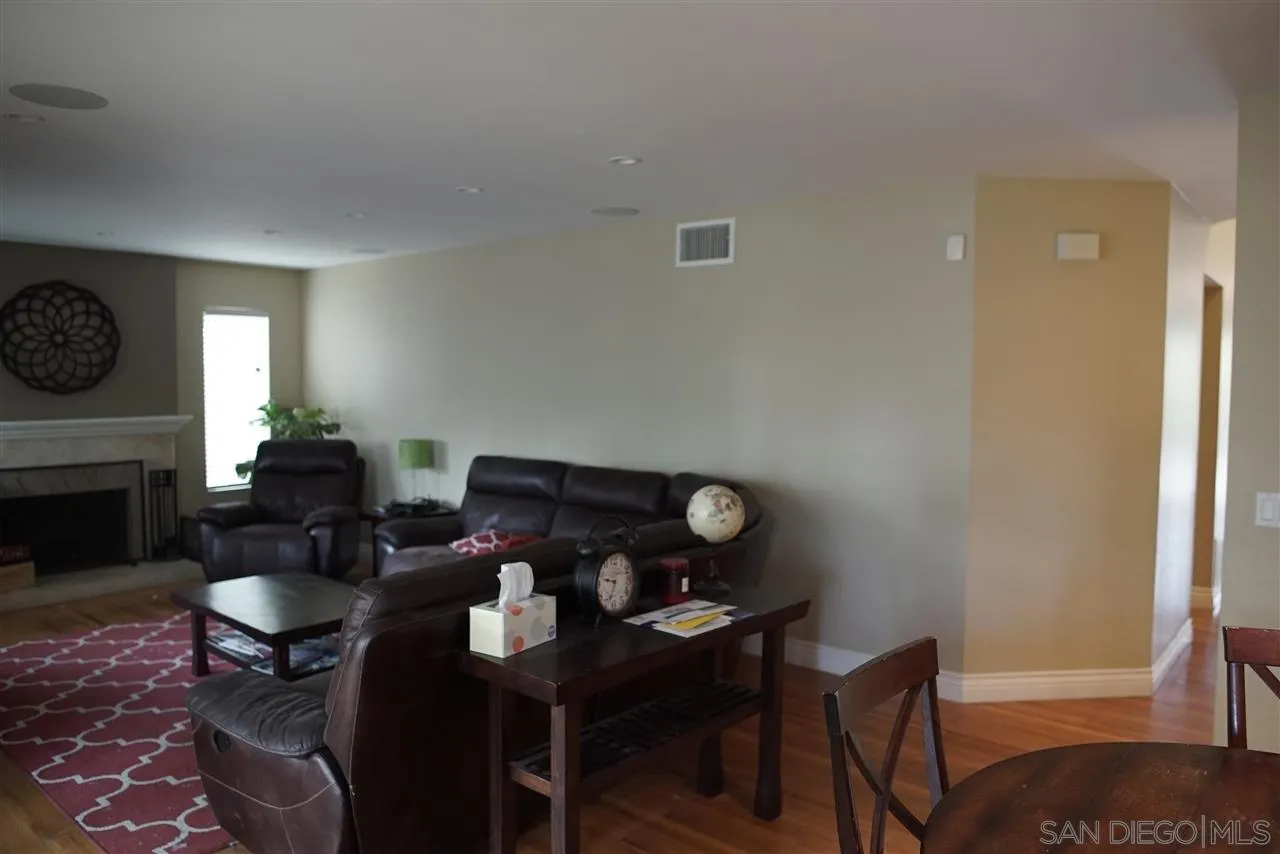 12701 Triumph Drive Poway, CA 92064 - Photo 5 of 21 a view of a livingroom with furniture and a fireplace