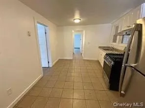 a view of a storage & utility room with a sink