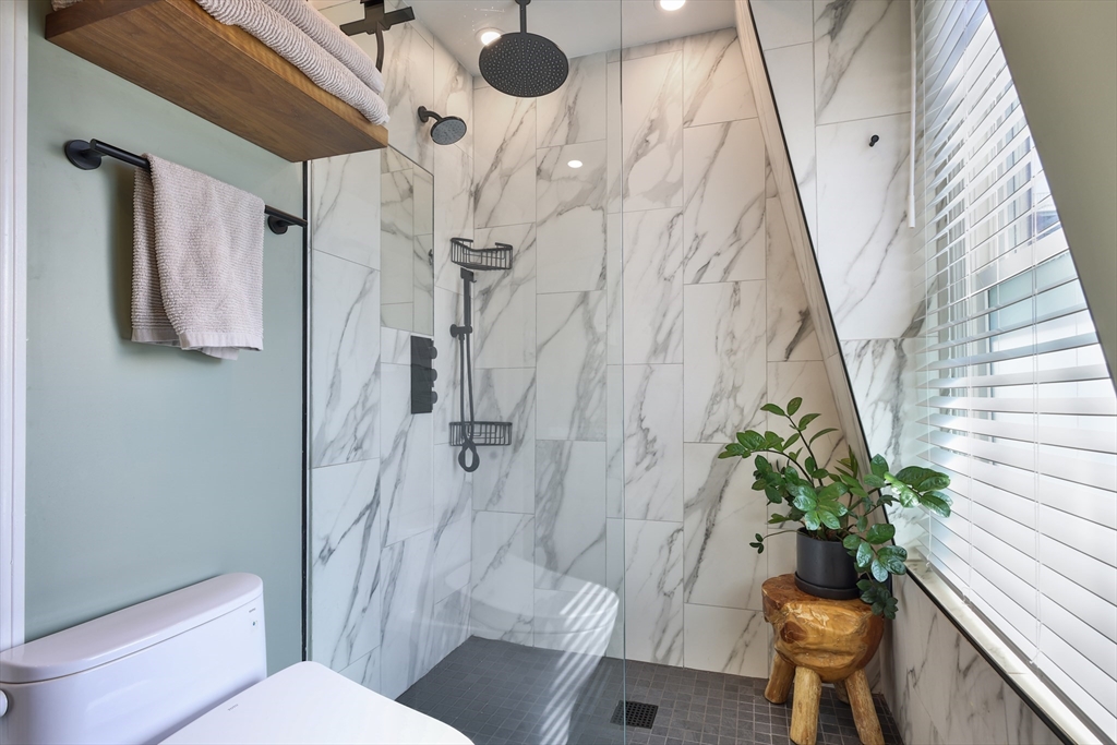 649 East 3rd Street, Unit 2 Boston, MA 02127 - Photo 11 of 16 a bath room with a toilet and a shower