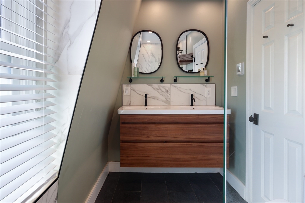 649 East 3rd Street, Unit 2 Boston, MA 02127 - Photo 12 of 16 a bathroom with a sink and a mirror