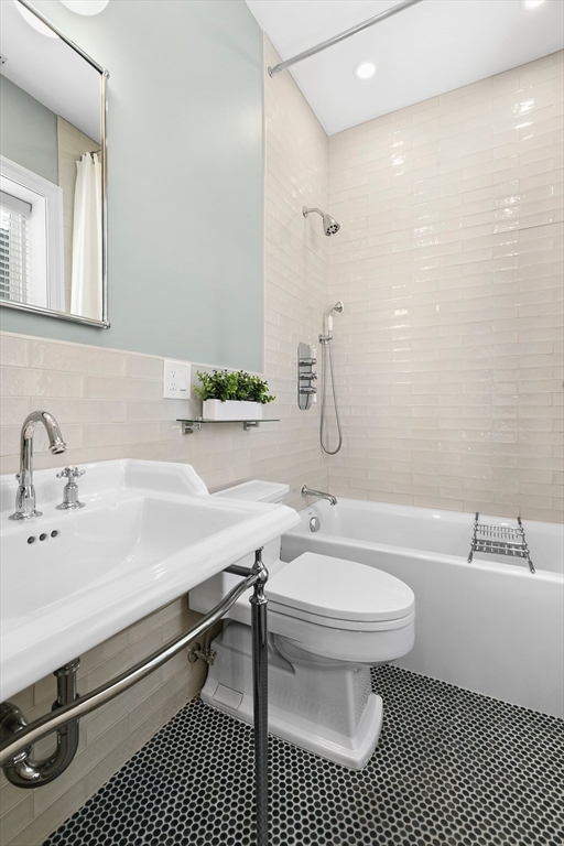 649 East 3rd Street, Unit 2 Boston, MA 02127 - Photo 8 of 16 a bathroom with a sink toilet a mirror and shower