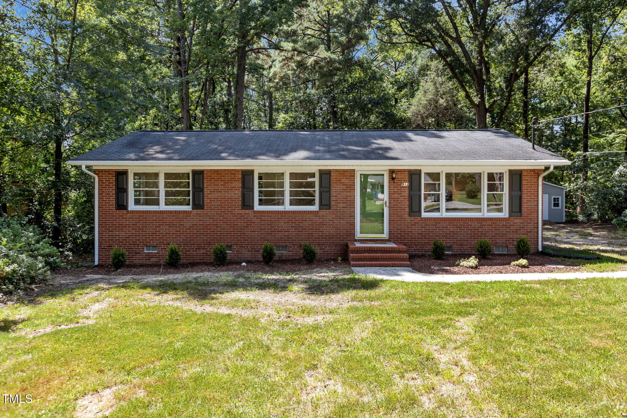 912 Williams Road Raleigh, NC 27610 - Photo 1 of 19 a backyard of a house with yard fire pit and outdoor seating