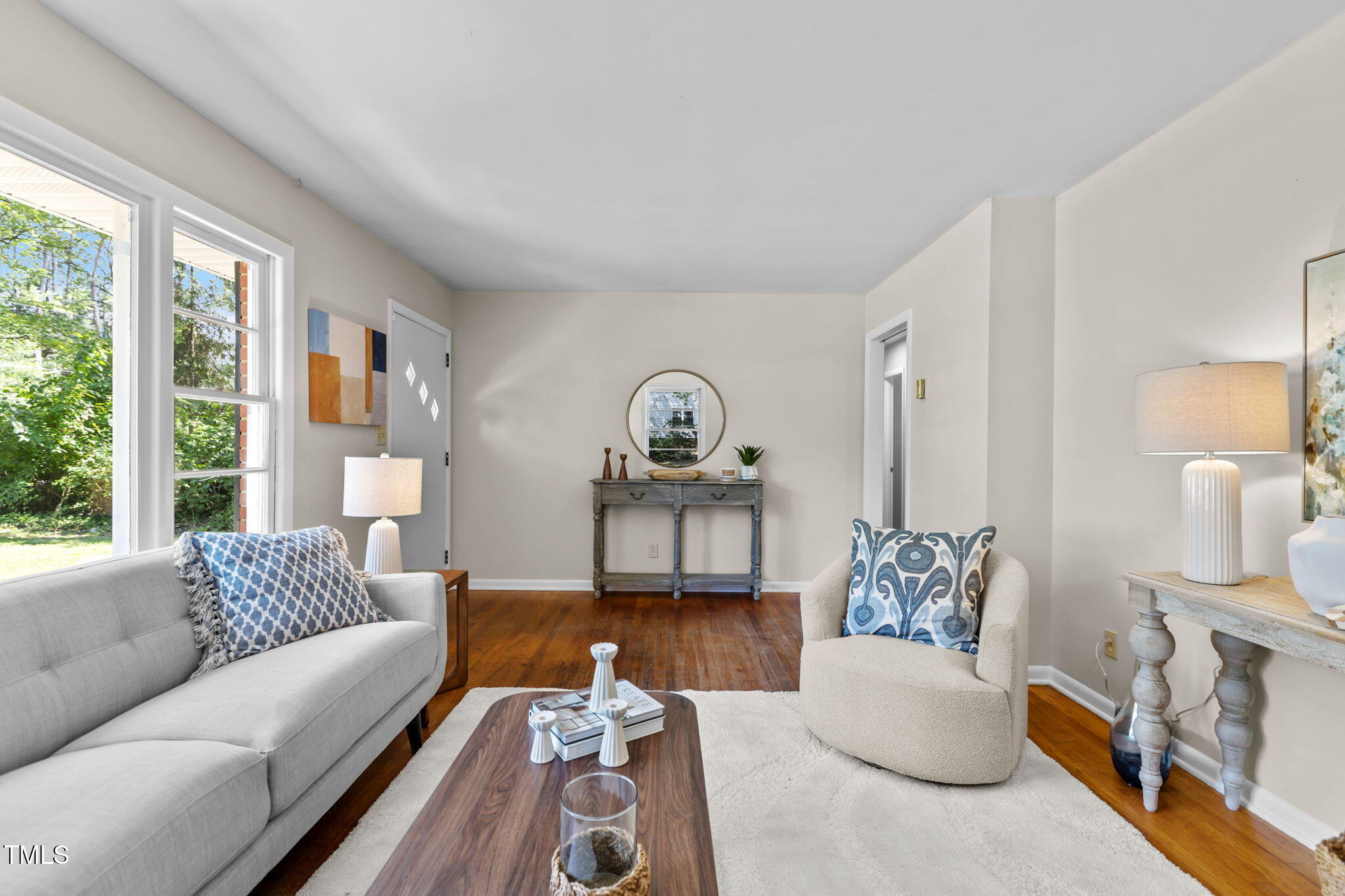912 Williams Road Raleigh, NC 27610 - Photo 5 of 19 a living room with furniture a rug and a large window