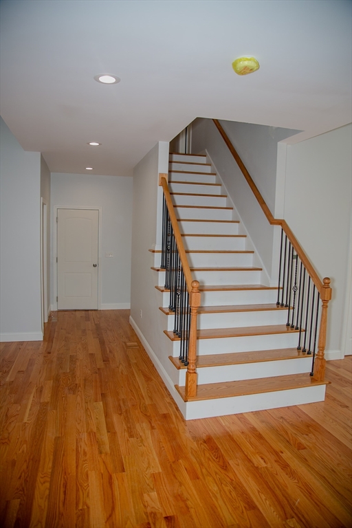 99 West Crystal Brook Drive Springfield, MA 01118 - Photo 13 of 40 a view of a room with wooden floor and stairs