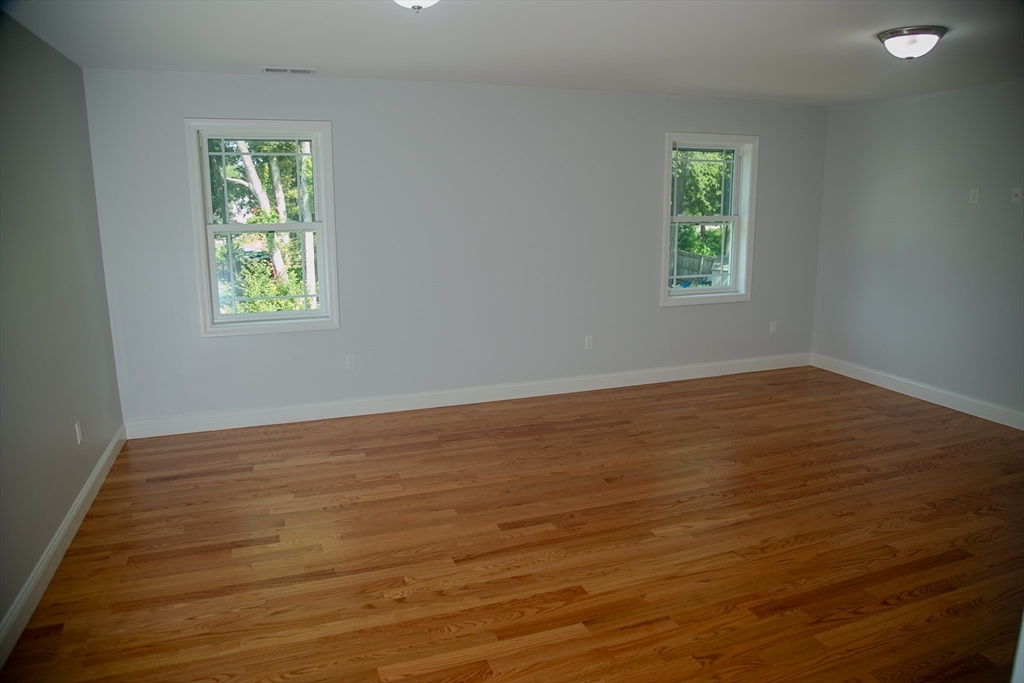 99 West Crystal Brook Drive Springfield, MA 01118 - Photo 28 of 40 a view of an empty room with wooden floor and a window