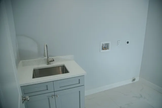 a bathroom with a sink and vanity