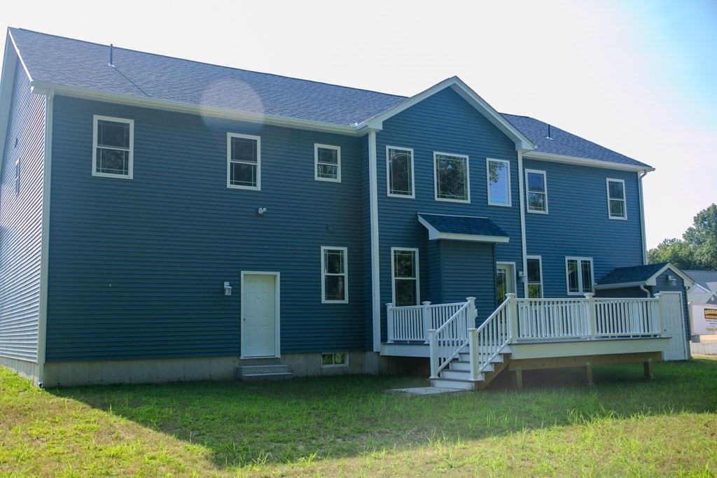 99 West Crystal Brook Drive Springfield, MA 01118 - Photo 40 of 40 a front view of a house with a garden and yard