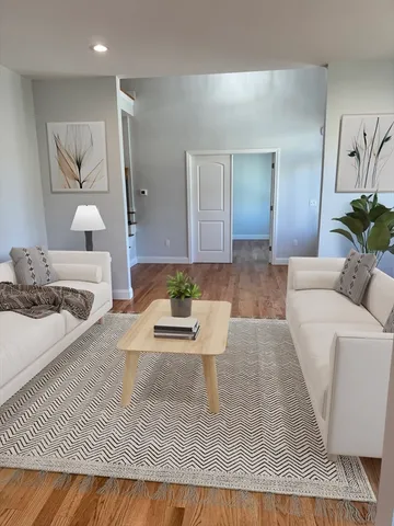 a living room with furniture and a table