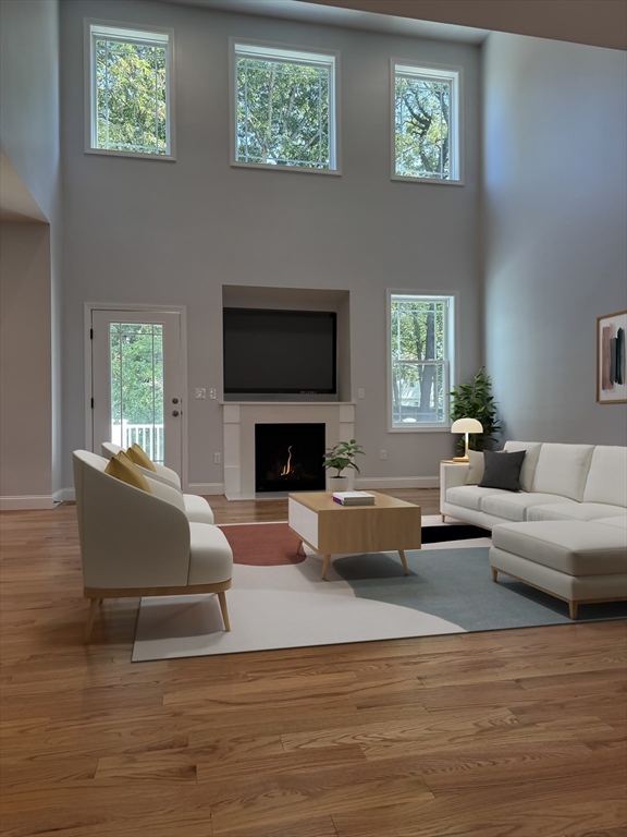99 West Crystal Brook Drive Springfield, MA 01118 - Photo 8 of 40 a living room with furniture and a fireplace