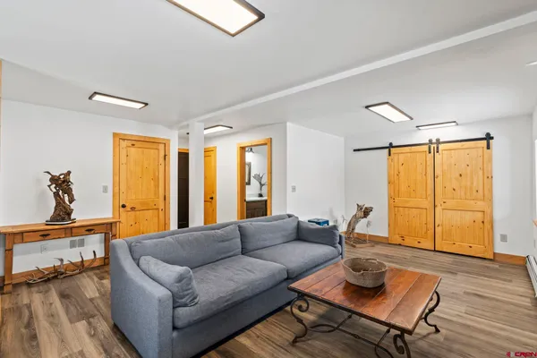 a picture of a room with a white wall and picture