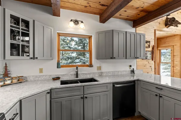 a kitchen with stainless steel appliances a refrigerator stove and microwave