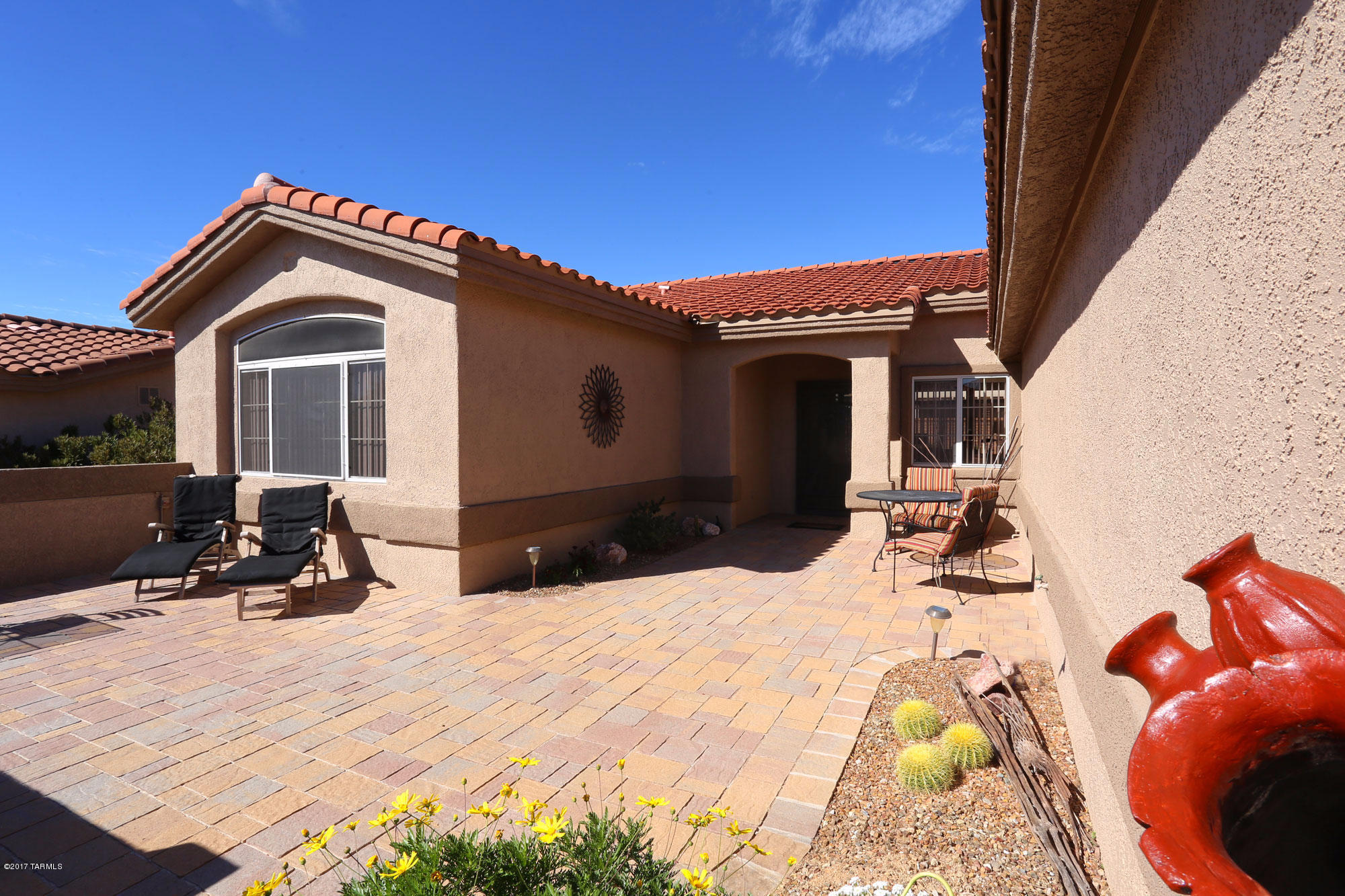 1065 East Royal Oak Road Oro Valley, AZ 85755 - Photo 3 of 19 a view of a house with a patio