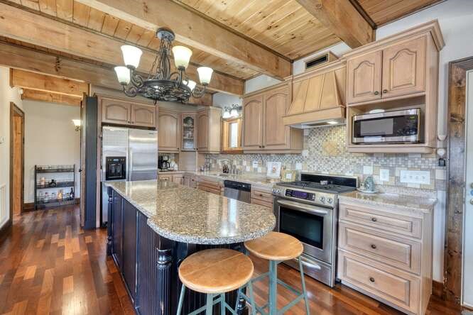 230 Smokin Ridge Hayesville, NC 28904 - Photo 6 of 55 a kitchen with stainless steel appliances granite countertop a sink and cabinets