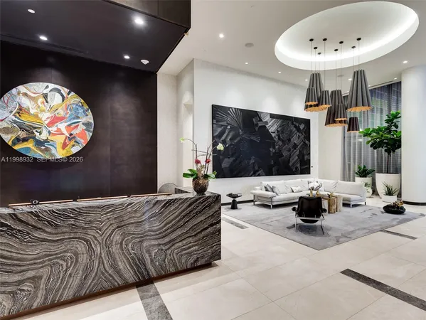 a bedroom with a bed and glass wall