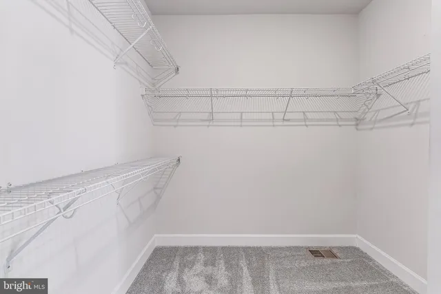 a view of a room with racks on the wall