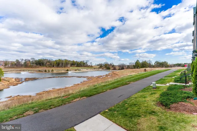 a view of a lake with houses in the back
