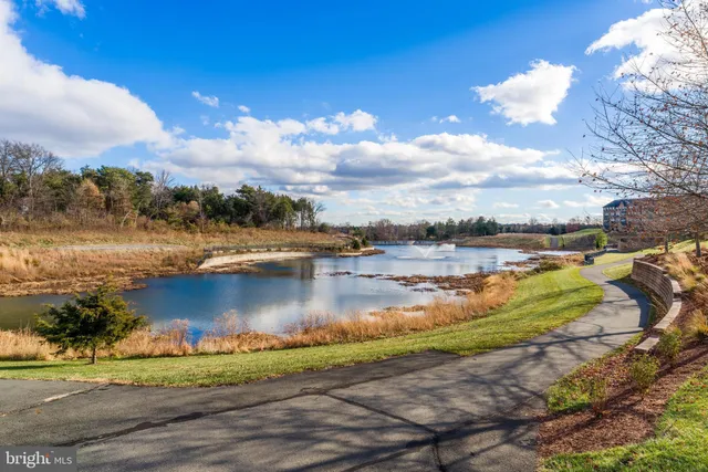 a front view of a building with lots of trees