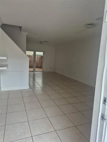 a view of a livingroom with an empty space and a sink