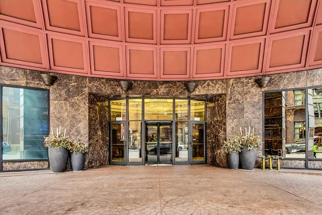 a view of a building with sitting area