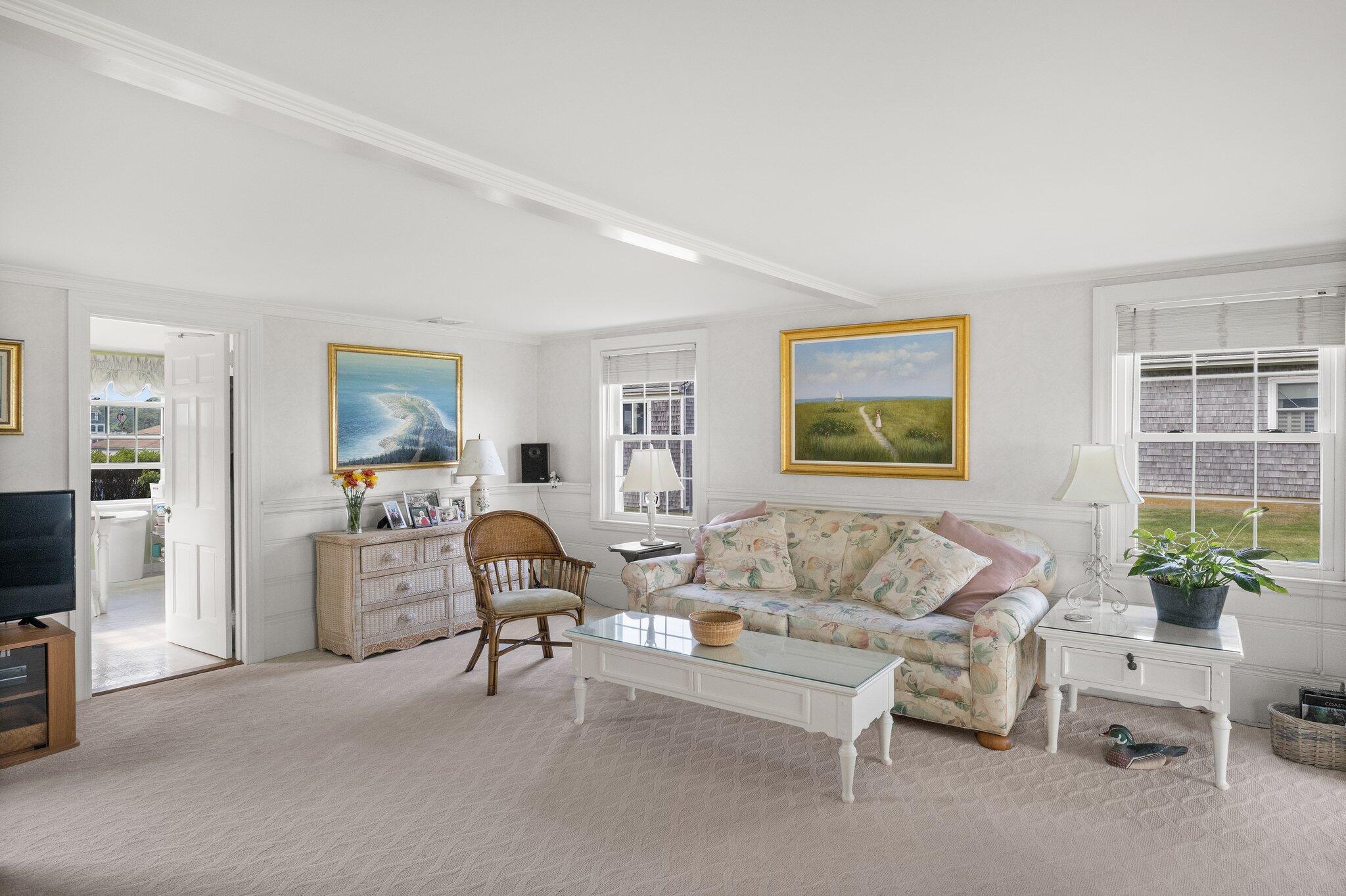 103 Long Beach Road Centerville, MA 02632 - Photo 13 of 36 a living room with furniture and a flat screen tv