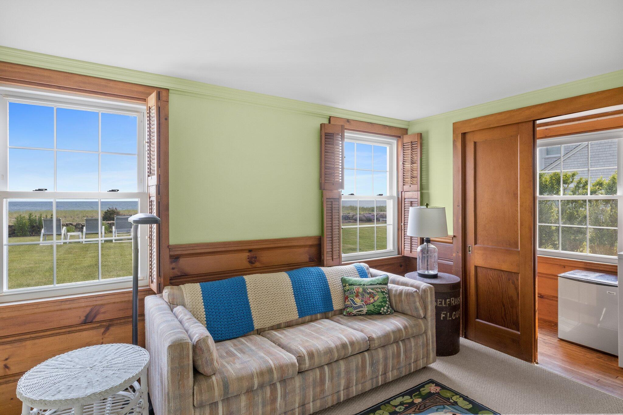 103 Long Beach Road Centerville, MA 02632 - Photo 20 of 36 a living room with furniture and a window