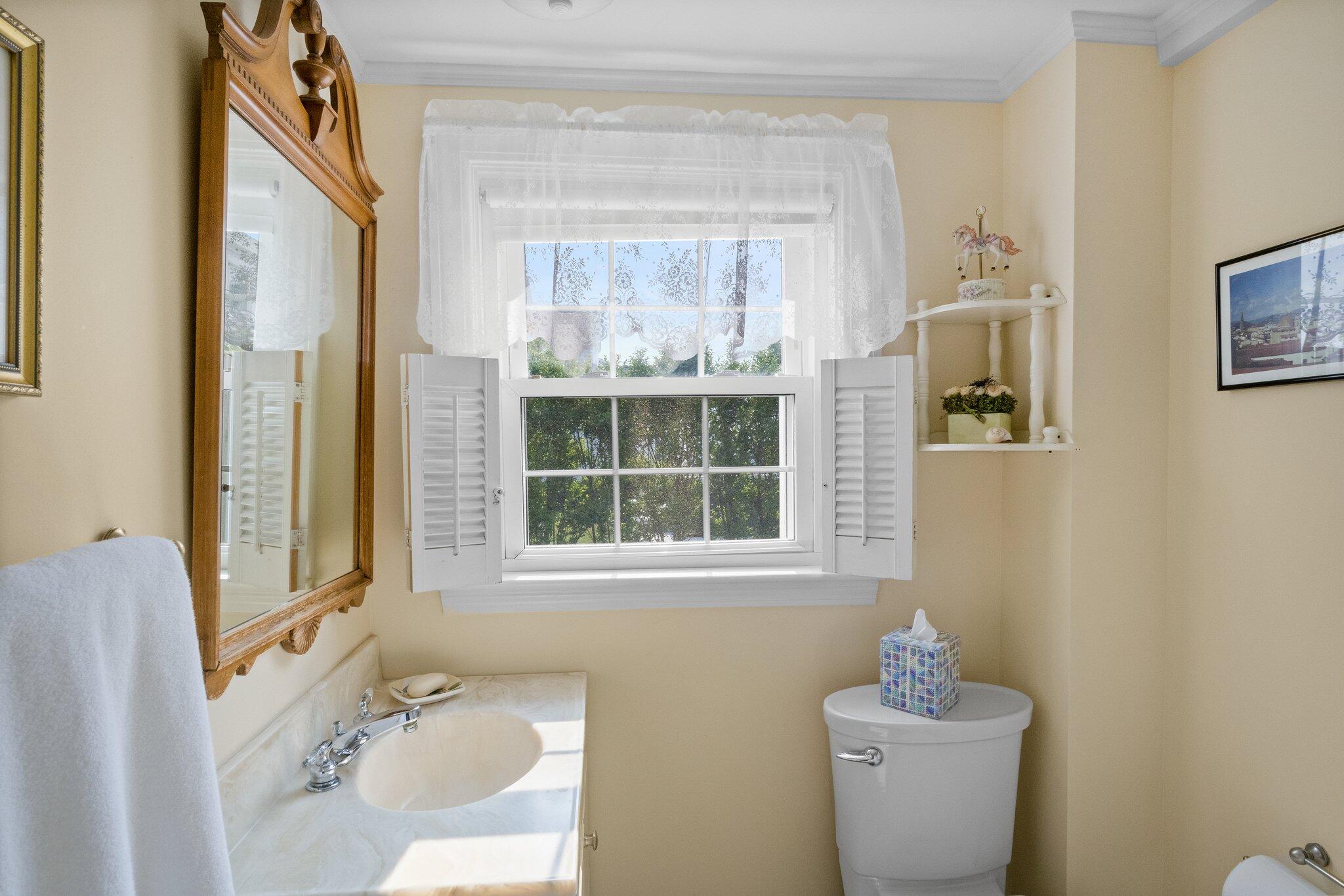 103 Long Beach Road Centerville, MA 02632 - Photo 22 of 36 a bathroom with a sink mirror and toilet