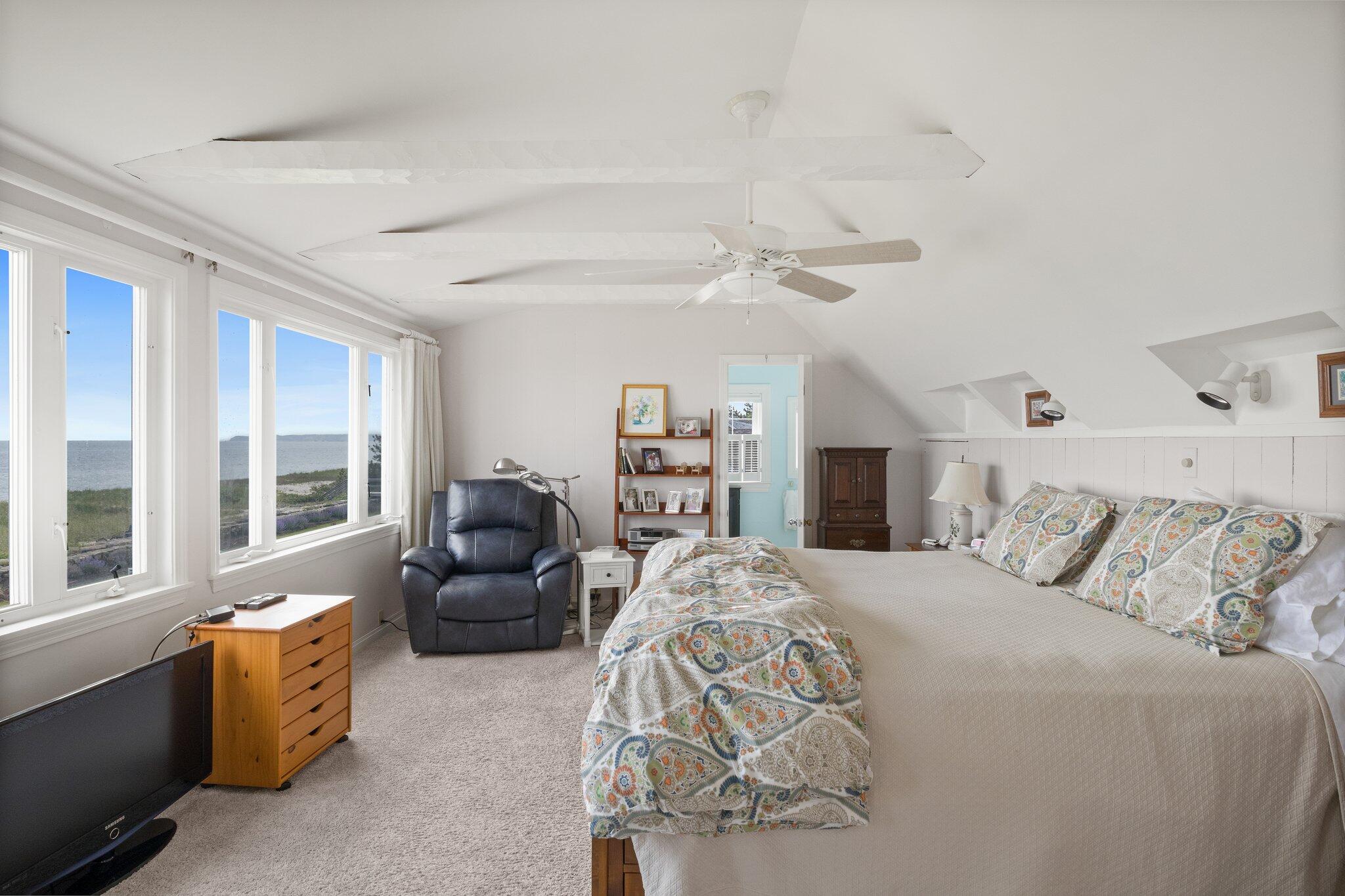 103 Long Beach Road Centerville, MA 02632 - Photo 24 of 36 a bedroom with furniture and large windows