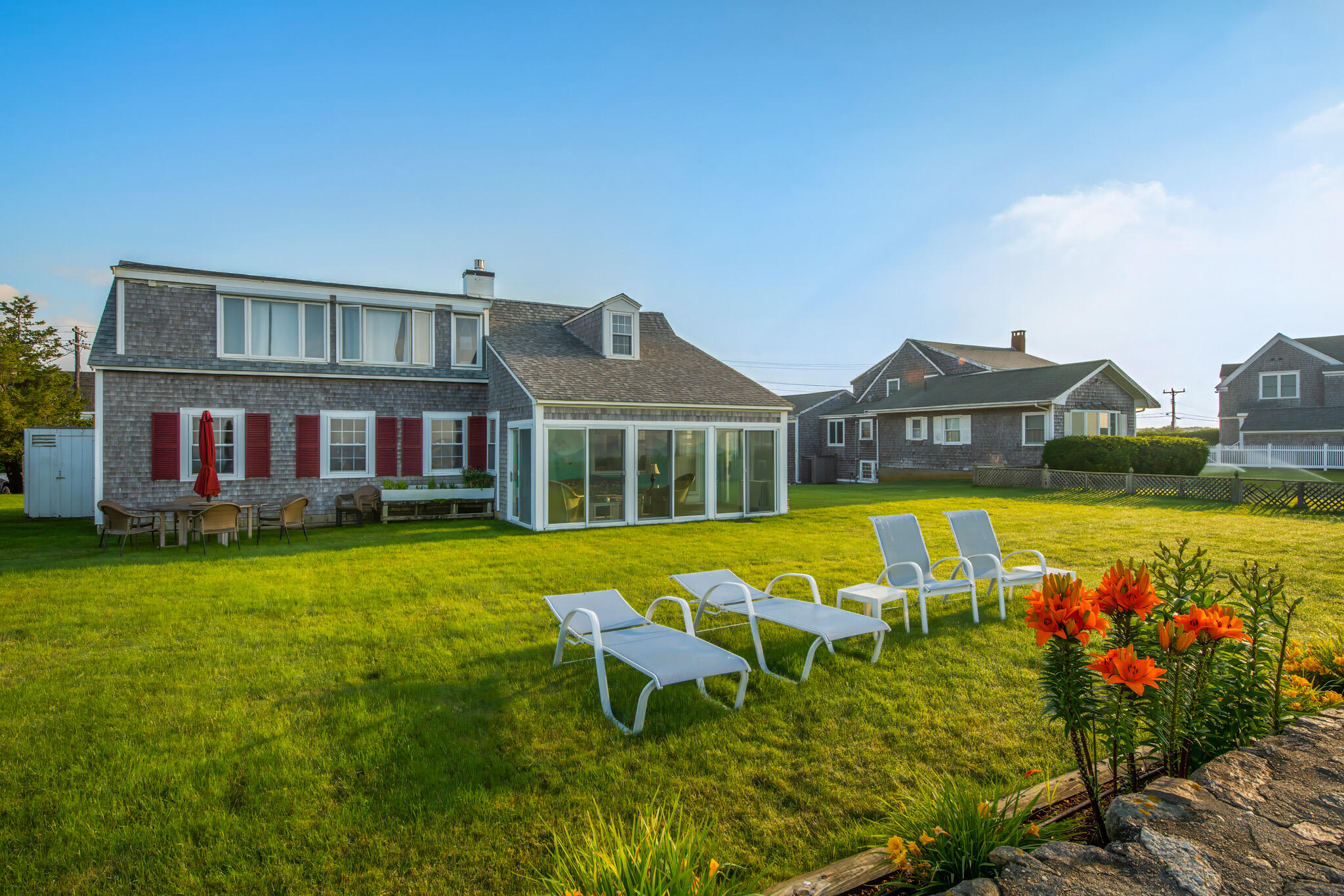 103 Long Beach Road Centerville, MA 02632 - Photo 28 of 36 a view of a house with swimming pool and yard