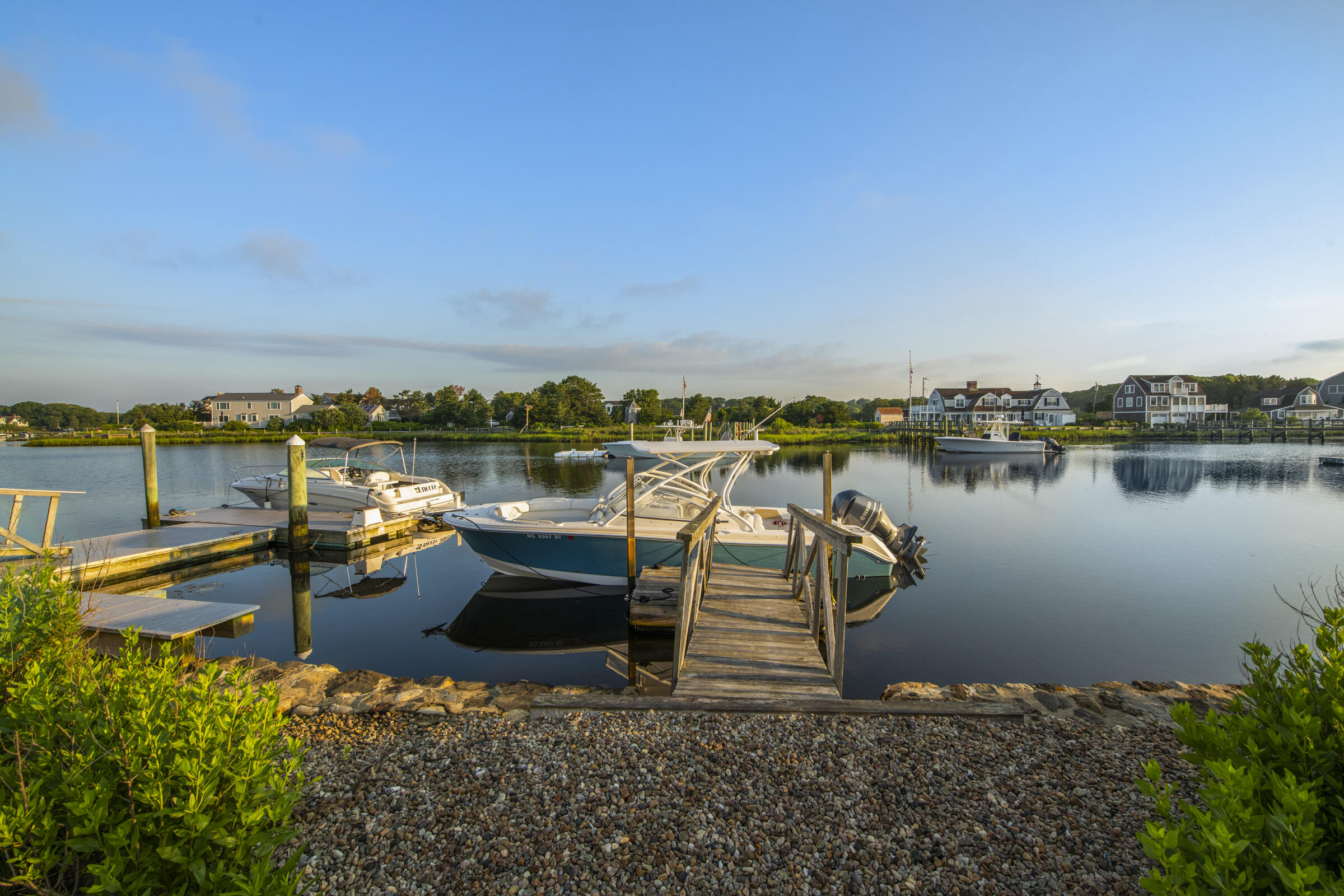 103 Long Beach Road Centerville, MA 02632 - Photo 4 of 36 a view of a lake with houses in the back
