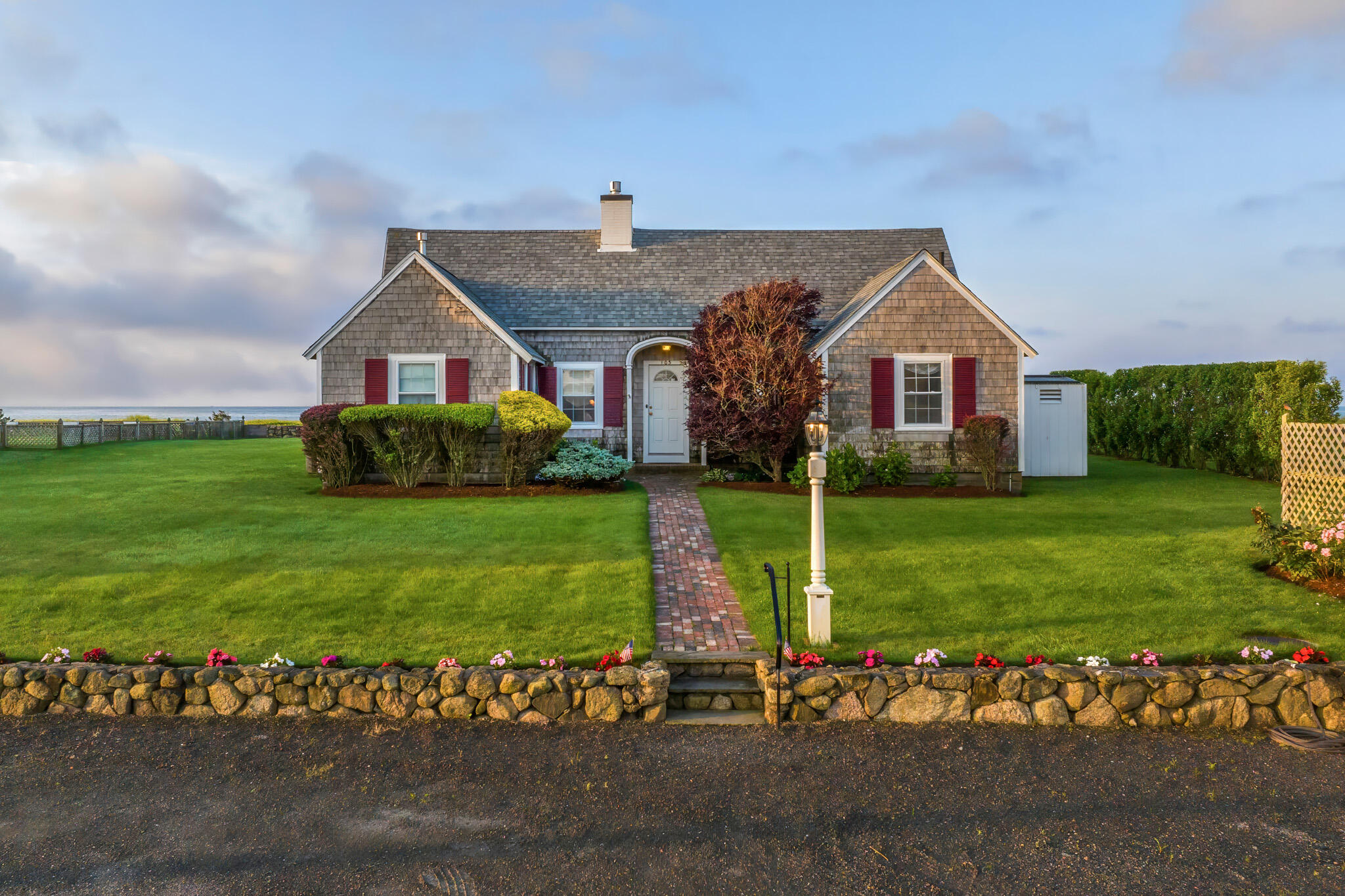 103 Long Beach Road Centerville, MA 02632 - Photo 8 of 36 a front view of a house with garden