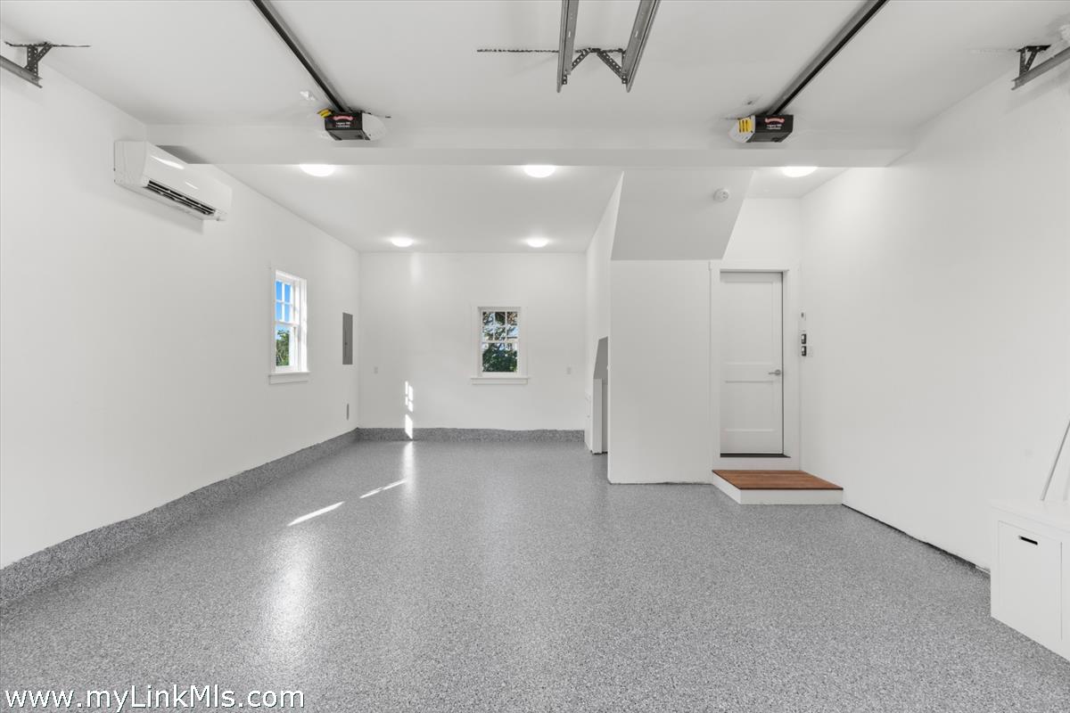 3 Tautemo Way Nantucket, MA 02554 - Photo 57 of 57 an empty room with wooden floor and windows