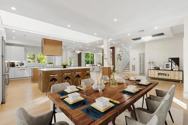 a dining room with furniture and wooden floor