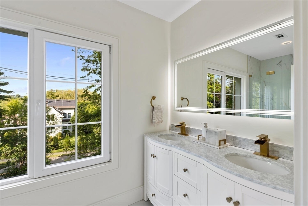 58 Chestnut Street Lynnfield, MA 01940 - Photo 22 of 42 a bathroom with a granite countertop sink mirror and window