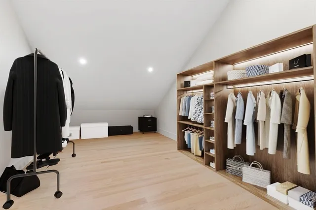 a view of a livingroom with furniture and staircase