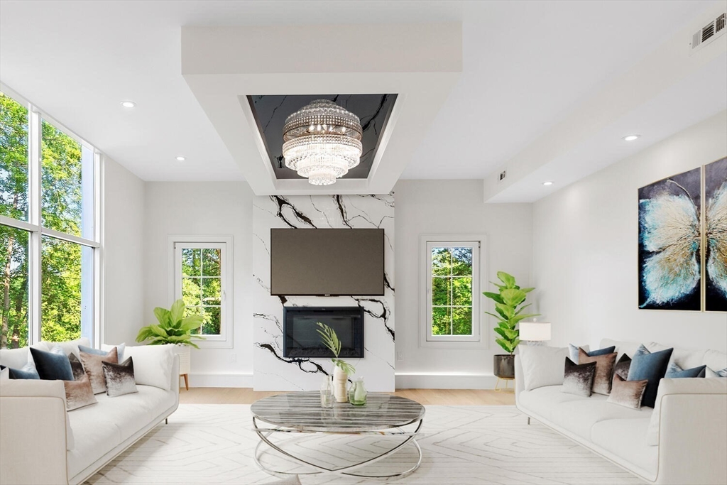 58 Chestnut Street Lynnfield, MA 01940 - Photo 3 of 42 a living room with furniture a window and a fireplace