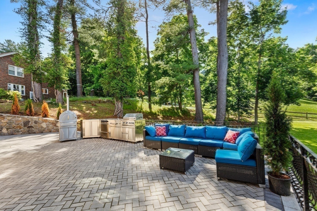 58 Chestnut Street Lynnfield, MA 01940 - Photo 35 of 42 a outdoor sitting area with furniture and a potted plant