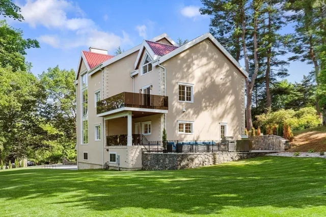 a view of a big house with many windows