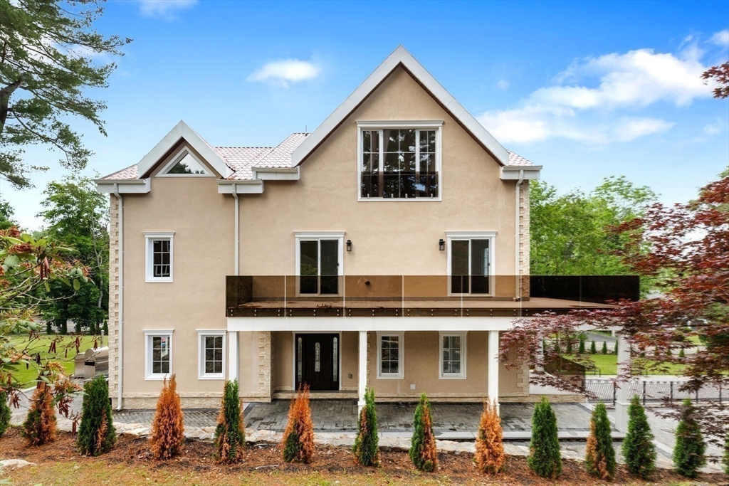 58 Chestnut Street Lynnfield, MA 01940 - Photo 40 of 42 a view of a big house with many windows