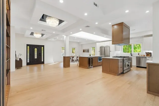 a large room with a large window and chairs