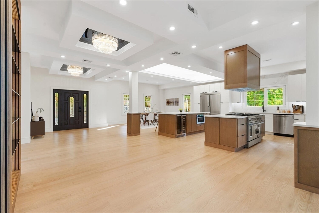 58 Chestnut Street Lynnfield, MA 01940 - Photo 8 of 42 a large room with a large window and chairs