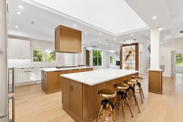 a kitchen with a table and chairs in it