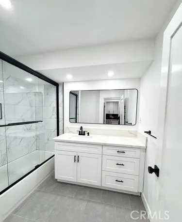 a kitchen with kitchen island stainless steel appliances a sink and a window