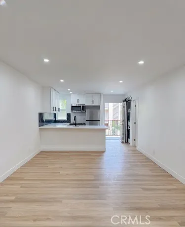 a view of kitchen and kitchen with furniture