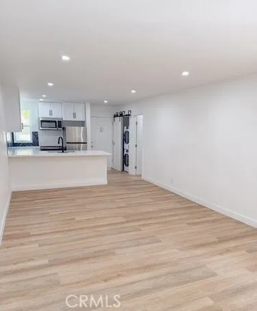 a bathroom with a toilet sink a mirror and vanity